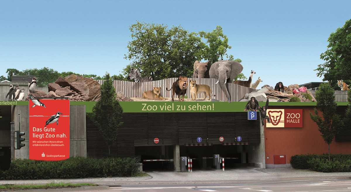Werbebild vom Bergzoo Halle mit Zootieren und der Parkhauseinfahrt des Zoos